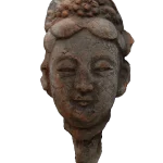 Head of a Galbinga sculpture with an updo hairstyle and floral hair ornament.