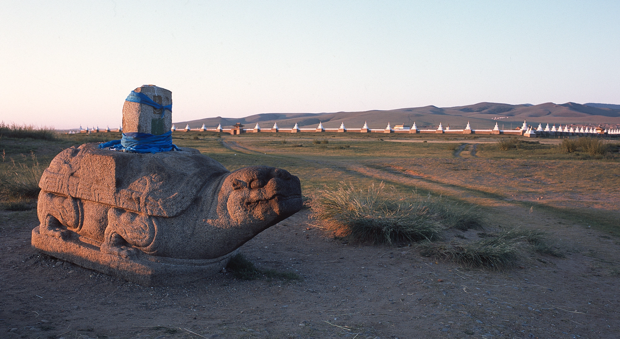 The stone turtle in front of the Great Hall in Karakorum at sunset.